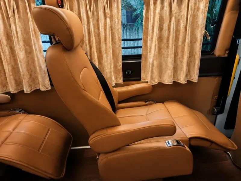 Premium recliner seat with footrest and privacy curtains